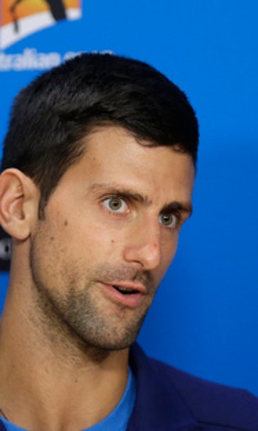 The Latest: Djokovic leads Australian Open final by 2 sets
